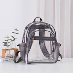 Clear Stadium Backpack With Grey Trim * Solid Trim Medium Clear Backpack * Light-Weight, Simple Design For Everyday Essentials * Perfect Daily Backpack To Take Anywhere * Zipper Closure With Multiple Pockets And Key Hooks * **Size: Approx. 11" L X 6.2" W X 15.8" H ** Last 5 Pictures Shows Other Views And Details In Black Trim Version Clear Standard Backpack For Travel, Back To School Travel Backpack With Clear Strap, Everyday Bags With Clear Strap For Back To School, Clear Backpack For Everyday Use And Back To School, Travel Backpack With Clear Strap, Everyday Clear Strap Bags For Back To School, Casual Standard Backpack With Clear Strap, Clear Travel Bag For Back To School, Back To School Backpack With Clear Strap