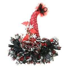 a red and black christmas hat with snowflakes on it