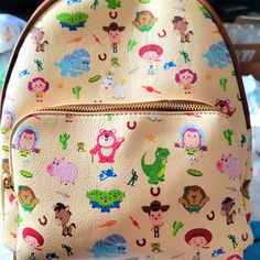 Super Awesome Danielle Nicole Disney Toy Story Great Backpack Design. Exclusive And Hard To Find. This Is A Fun Summertime Bag. It Has A Large Zipper Compartment And A Smaller Zipper Compartment On The Front With Adjustable Leather Straps. Great For Everyday Use. Cute Multicolor Backpack For Disney Trips, Cute Bags For Disney Trips, Cute Multicolor Bags For Disney Trips, Disney Multicolor Backpack For Daily Use, Multicolor Disney Backpack For Daily Use, Multicolor Backpack For Disney Fan Events, Disney Backpack, Danielle Nicole Disney, Backpack Design