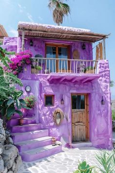 a purple house with steps leading up to it