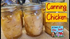 three jars filled with canned food sitting on top of a counter next to a sign that says canning chicken