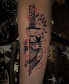 a tattoo on the leg of a person with a knife in it's hand