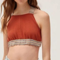 Nwot Urban Outfitters Ultra-Cropped Top In Rust Color Fitted With Stretchy Shoulder Straps That Cross At The Open Back High Neck Silhouette Trimmed With Stripped Elastic Band On The Straps And Bottom 60% Cotton 40% Polyester *Fits Like A Medium* Casual Orange Sleeveless Halter Top, Casual Orange Halter Top For Spring, Trendy Cotton Crop Top By Urban Outfitters, Casual Brown Sleeveless Halter Top, Brown Cotton Crop Top For Day Out, Casual Orange Crop Top For Day Out, Urban Outfitters Cotton Crop Top, Urban Outfitters Cropped Stretch Tank Top, Casual Cropped Halter Top With Stretch