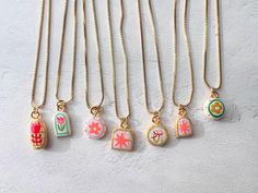 These tiny handmade charm necklaces are made  by me in my home in Los Angeles. ♡ Each pendant is handmade from lightweight air-dry clay, painted, and glazed. ♡ Chain is  18k Gold Filled  ♡  Chain is 16inch (+ 2" extender) ♡Charm Measures : about the size of a dime or smaller ♡ Important Care Instructions: For the longevity of your charm, avoid exposure to excess moisture, and do not wear it in the shower or swimming pool. Air Clay Necklace, Clay Charms Necklaces, Polymer Clay Charm Necklace, Clay Charm Necklace, Air Dry Clay Necklace Pendants, Air Dry Clay Charms, Whimsical Pendant Charm Necklace, Handmade Enamel Pendant Charm Necklace, Ceramic Charm Necklace