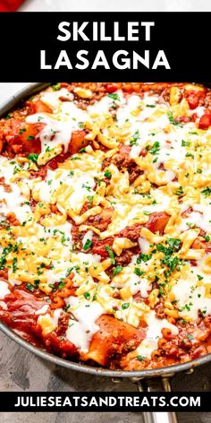 skillet lasagna with cheese and sauce in a pan on a wooden table