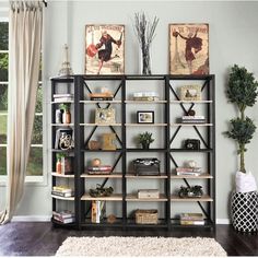 a bookshelf with several shelves and pictures on the wall