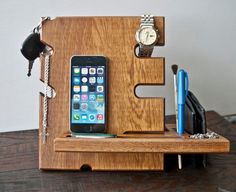 a cell phone and pen holder made out of wood