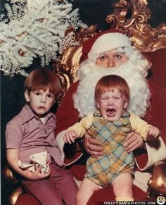 an old photo of santa claus with two children