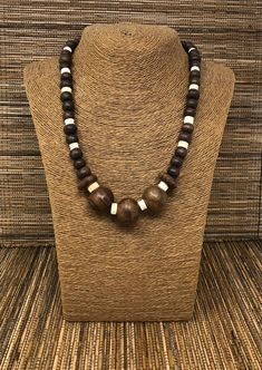 "Wooden Necklace. Beaded Necklace. Handmade with brown wooden beads Unisex Design. 20\" inches Around the Neck. Fits Most Sizes FAST SHIPPING! *First Class Mail Visit my Etsy Shop to see more Designs! Handmade Wooden Earrings, Wooden Bracelets and Necklaces. Click here to see more designs: https://www.etsy.com/shop/FreedomLifeStyle" Neck Beads For Men, Bohemian Brown Necklace With Wooden Beads, Brown Wooden Beaded Necklaces For Festivals, Rustic Wooden Bead Necklaces For Festivals, Natural Wooden Beads Necklace, Brown Wooden Beads For Jewelry Making, Adjustable Brown Necklace With Large Beads, Rustic Wooden Beads Necklace For Festival, Rustic Wooden Bead Necklace For Festivals