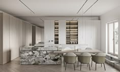 a kitchen with marble counter tops and chairs