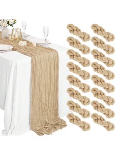 the table is set with place settings and napkins on it, along with several pieces of rope