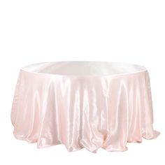 a round table covered in pink satin