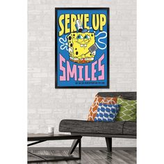 a couch in front of a brick wall with a poster on it that says serve up smiles