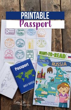 the printable passport is sitting on top of a wooden table with other travel stickers