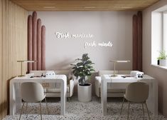 there is a white table and chairs in the dining room with pink walls behind it