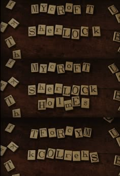 scrabbled letters are arranged on a wooden surface