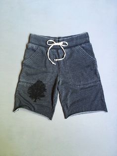 "Comfy, soft and easy GYM shorts for the guys. Shorts are dark grey and made of a pre-washed and soft cotton/poly blend with two big side pockets and a 2\" elastic waist with a drawstring. I print a black oak tree on the front of one leg. Dark Grey small: waist- 32\"-34, 19\" from top of waist to bottom of leg medium: waist- 36\"-38\", 20\" length large: waist- 38\"-40\", 21\" length xlarge: waist- 40\"-42\", 22\" length shop policy: because i hand print each order once it is placed, sales are f Cotton Workout Shorts With Drawstring, Casual Cotton Gym Shorts, Comfortable Gray Athletic Shorts With Relaxed Fit, Gray Cotton Workout Shorts, Gray Cotton Athletic Shorts, Sporty Gray Shorts For Leisure, Sporty Gray Leisure Shorts, Gray Cotton Workout Bottoms, Sporty Gray Cotton Shorts