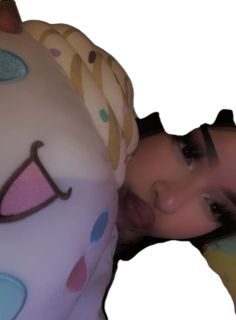 a woman is laying down with her head on the back of an inflatable unicorn