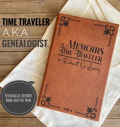 a book sitting on top of a wooden table next to a white napkin with the title time traveler akaa