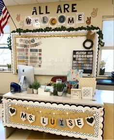 a decorated desk with an american flag hanging from it's side and the words welcome to me written in large letters