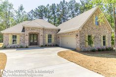 a large brick house with lots of trees around it