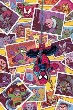 the amazing spider - man is hanging from a rope in front of many other comics