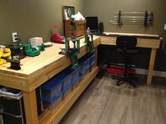 a workbench with tools and other items on it in an office space that appears to be empty