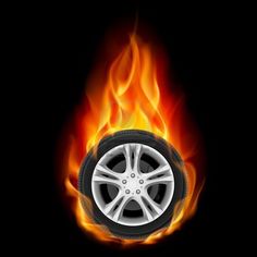 a tire on fire with black background