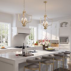 a large kitchen with white cabinets and gold chandelier hanging from the ceiling, surrounded by stools