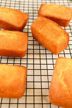 several pieces of bread sitting on top of a cooling rack