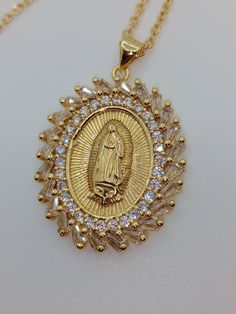 Introducing our Lady of Guadalupe collection. Virgin Mary Medallion Pendant, a stunning and meaningful piece of jewelry that celebrates the iconic religious symbol of the Virgin Mary. Crafted with solid stainless steel and gold plating, this pendant is the perfect addition to any jewelry collection. The medallion pendant features intricate detailing that beautifully captures the image of the Lady of Guadalupe, creating a stunning and meaningful piece. The pendant is durable and long-lasting, ensuring it will be cherished for years to come. This Lady of Guadalupe Virgin Mary Medallion Pendant is the perfect gift for any religious occasion or for anyone who appreciates the beauty and significance of this iconic symbol. It is a stylish and elegant piece of jewelry that will add a touch of rel Virgin Of Guadalupe, Our Lady Of Guadalupe, Religious Symbols, The Virgin Mary, Lady Of Guadalupe, Hippie Necklace, Opal Bracelet, Blue Opal, Our Lady