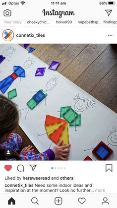 an instagram page with a child playing with paper kites on top of it