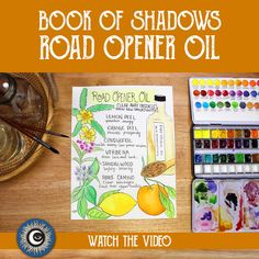 the book of shadows road opener oil is displayed on a table with watercolors