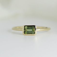 Bezel Set Green Tourmaline Ring, Emerald Cut Tourmaline Ring – Melt'm Jewelry Gold Ring Band, Jewelry Design Studio, Tourmaline Engagement Ring, Green Tourmaline Ring, Minimalist Engagement Ring, Garnet And Gold, Emerald Cut Rings, Plastic Ring, Solid Gold Ring