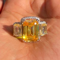 Yellow Diamond Ring featuring semi precious canary yellow stone and cz diamonds. Ideal to pair with your india western sarees and formal outfits. These large statement cocktail diamond ring will elevate your look. Perfect gift for her and gift for sister. *𝐏𝐑𝐎𝐃𝐔𝐂𝐓 𝐃𝐄𝐓𝐀𝐈𝐋* * 𝐌𝐚𝐭𝐞𝐫𝐢𝐚𝐥: Brass * 𝐏𝐥𝐚𝐭𝐢𝐧𝐠: White Rhodium Plated * 𝐒𝐭𝐨𝐧𝐞: AAA-quality CZ Diamond. 𝐕𝐢𝐬𝐢𝐭 𝐎𝐮𝐫 𝐅𝐀𝐐𝐬 𝐟𝐨𝐫 𝐒𝐡𝐢𝐩𝐩𝐢𝐧𝐠 𝐏𝐨𝐥𝐢𝐜𝐢𝐞𝐬 𝐚𝐧𝐝 𝐂𝐚𝐫𝐞 𝐈𝐧𝐬𝐭𝐫𝐮𝐜𝐭𝐢𝐨𝐧 *𝐃𝐈𝐒𝐂𝐋𝐀𝐈𝐌𝐄𝐑* * Product color may slightly vary due to photographic lighting sources or your screen settings. * Stone color may vary slightly due to variations in natural stones. *𝐒𝐈𝐌𝐈𝐋𝐀𝐑 𝐃𝐄𝐒𝐈𝐆𝐍* https://www.etsy.com/listing/1146740753/ Western Sarees, Cocktail Diamond Ring, Canary Yellow Diamonds, Yellow Sapphire Ring, Yellow Diamond Ring, Yellow Sapphire Rings, Yellow Diamond Rings, Formal Outfits, India Jewelry