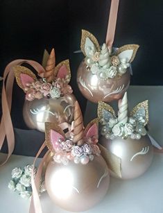 some pink and gold vases with unicorn decorations on them