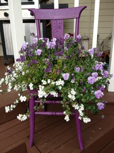 purple chair with flowers in it sitting on the porch