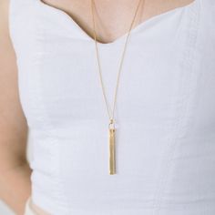 A fun version of the traditional bar necklace, the Coordinate Vertical Bar Necklace will help you keep a favorite place close to your heart. The vertical bar is custom engraved with your choice of coordinates, making it the perfect gift for graduations, weddings, engagements, and more. Available in 14k gold plated, rhodium plated or 14k rose gold plated brass Bar size: 2" by 3/16" 30" cable chain with 2" extender Lobster claw closure With engraving this item is FINAL SALE SKU: BYN1100 Minimalist Rectangular Bar Necklace As Personalized Gift, Minimalist Rectangular Bar Necklace For Personalized Gift, Minimalist Rectangular Pendant Bar Necklace For Personalized Gift, Traditional Bar, Vertical Bar Necklace, Brass Bar, Vertical Bar, Gold Bar Necklace, Roman Numeral