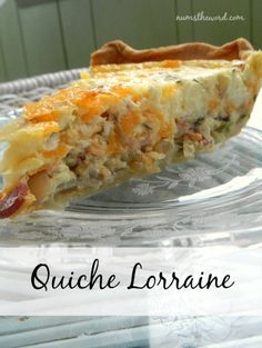 a slice of quiche loraine on a glass plate with the title above it