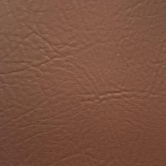 a close up view of a brown leather textured surface with no pattern or color