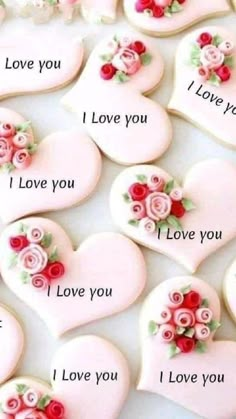 valentine's day cookies with roses on them and i love you written in the middle