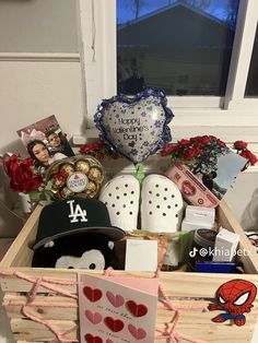 a wooden crate filled with personalized items and greeting cards for someone's birthday