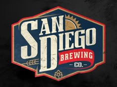 the san diego brewing co logo on a black background with red, white and blue colors