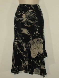 "Vintage Black & Ivory Floral JEIN BASIC Asymmetrical Kalf Length Skirt     Size - UK 14 EU 42   Please check measurements     LYING FLAT ON THE FLOOR:   SKIRTS LENGTH - 31'' OR ( 78.8 CM )  WAIST - 17.25\" OR ( 43.8 CM ) ACROSS THE BACK  HIPS - 19.5\" OR ( 49.6 CM )   The Skirt is used but in good condition,   please see all pic.  ############### *Please note that most of my items are vintage and has therefore been previously used unless stated otherwise. Vintage items will have some degree of Cute Skirt Outfits, Fashion Design Sketches, Cute Skirts, On The Floor, Dream Clothes, Types Of Fashion Styles, The Floor, Skirt Outfits, Look Cool