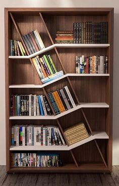 a bookshelf filled with lots of books on top of wooden shelves next to a wall