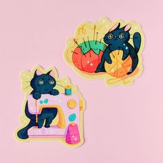 two stickers depicting black cats on sewing machine and cat sitting on the sewing machine