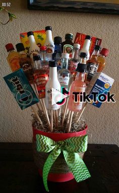 a basket filled with liquor bottles sitting on top of a table