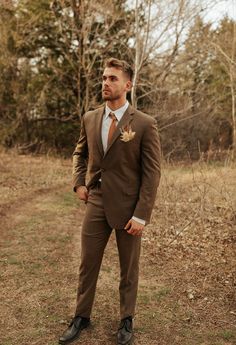 Fall wedding suit for groom Rust Wedding Aesthetic, Groom Terracotta Wedding, Terracotta And Sage Groomsmen, Shades Of Brown Groomsmen Suits, Terracotta Wedding Theme Groomsmen, Rust And Brown Wedding, Rustic Groom Suit, Terracotta Bridal Party Groomsmen, Green And Brown Groomsmen