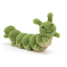 a green caterpillar stuffed animal laying on its side