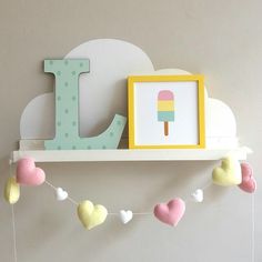 a wall shelf with an ice cream and heart garland